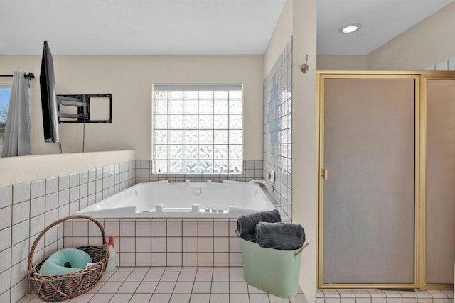 full bathroom with a bath, a shower stall, a wealth of natural light, and tile patterned floors