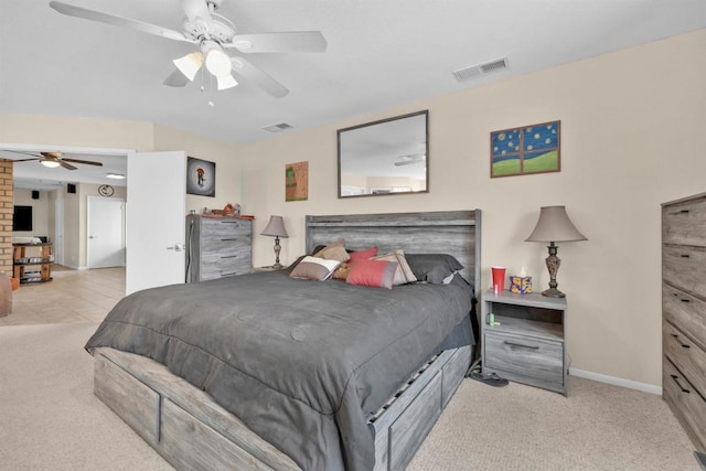 tiled bedroom featuring baseboards, ceiling fan, visible vents, and carpet flooring