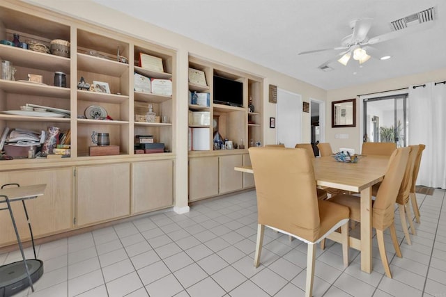 dining area featuring a ceiling fan, visible vents, and light tile patterned flooring