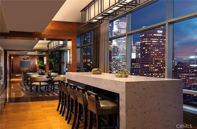 bar featuring a city view and wood finished floors