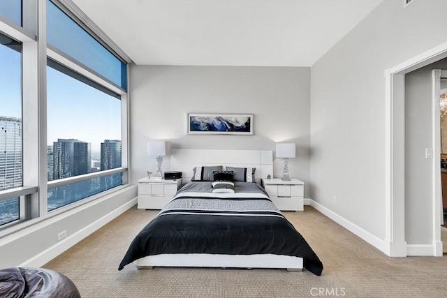 bedroom featuring carpet flooring and baseboards