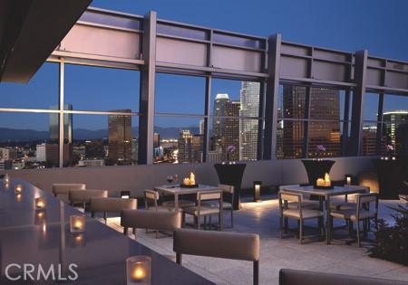 view of patio featuring an outdoor living space and a city view