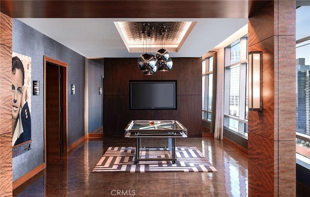 dining room featuring a tray ceiling and an inviting chandelier