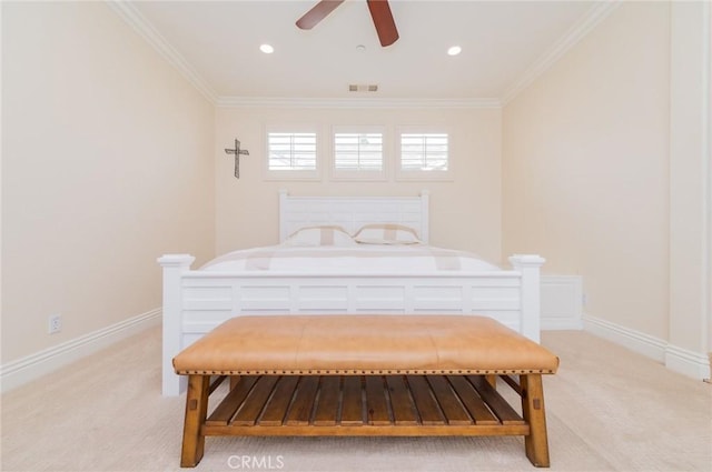 bedroom featuring light carpet, baseboards, visible vents, and ornamental molding