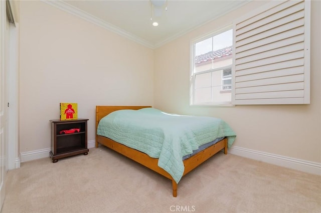 bedroom featuring ornamental molding, carpet, and baseboards