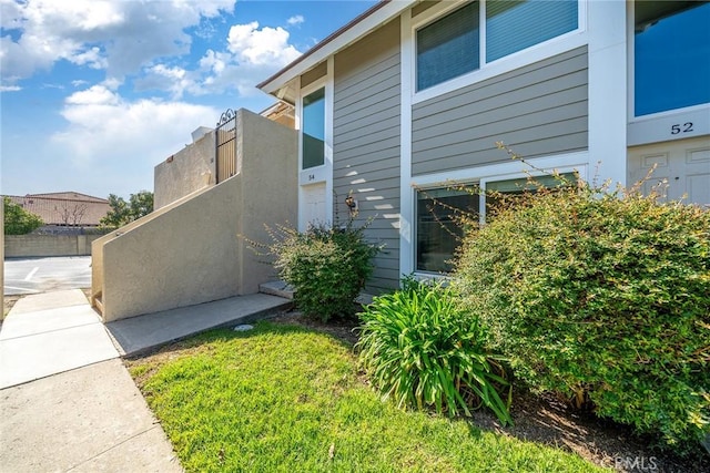 view of home's exterior with fence