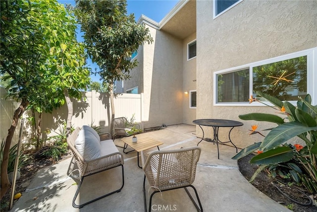 view of patio / terrace with a fenced backyard and an outdoor living space