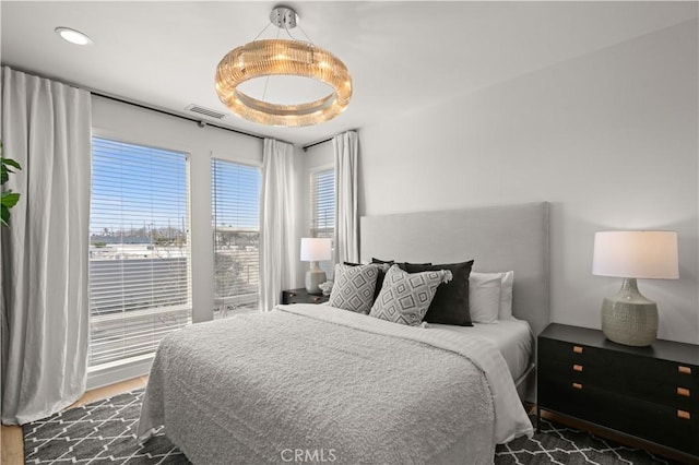 bedroom featuring visible vents