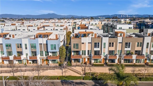 view of property featuring a mountain view and a residential view