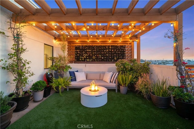 view of patio / terrace featuring an outdoor living space with a fire pit and a pergola