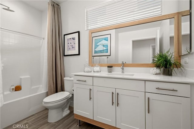 full bath with wood finish floors, toilet, vanity, and shower / bath combination with curtain