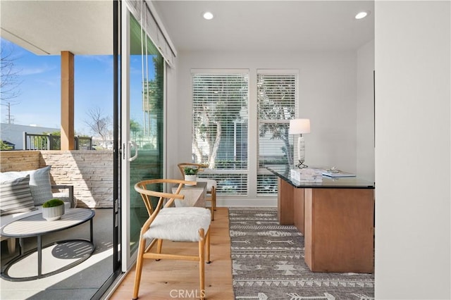 interior space with a wealth of natural light, wood finished floors, and recessed lighting