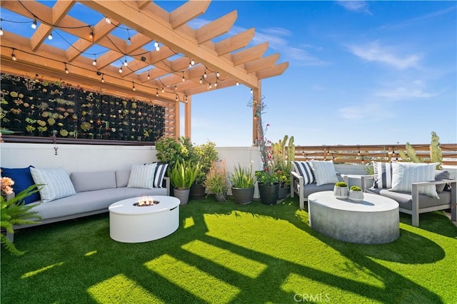 view of yard with an outdoor living space with a fire pit and a pergola