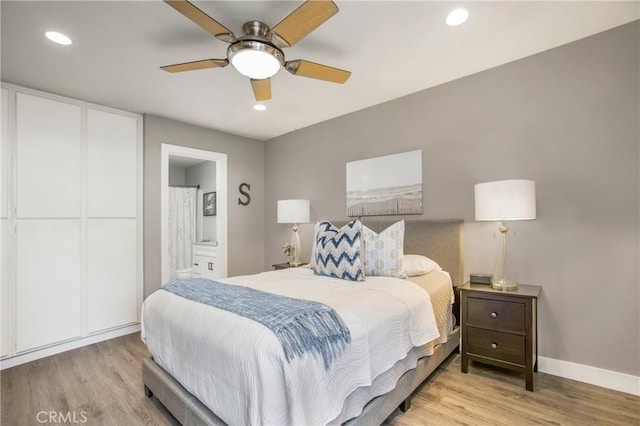 bedroom featuring light wood-type flooring, baseboards, and recessed lighting