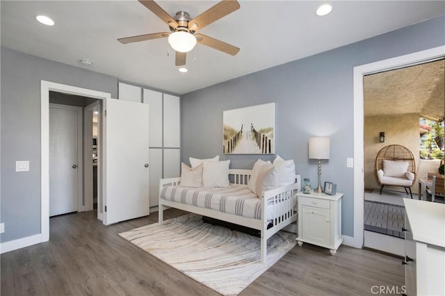 bedroom featuring recessed lighting, baseboards, and wood finished floors