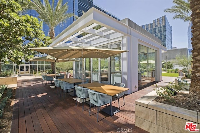 wooden deck with outdoor dining area