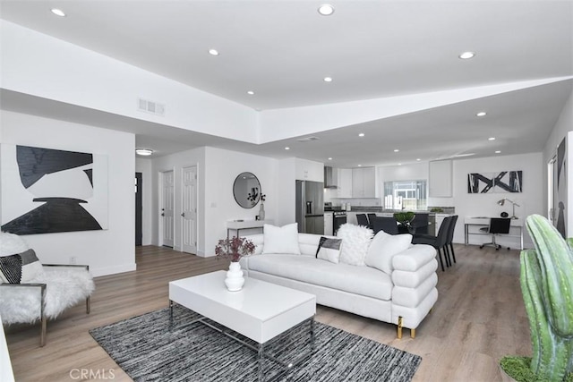 6215 Keystone St, Simi Valley, CA 93063 - living room featuring light wood-style flooring, recessed lighting, and baseboards
