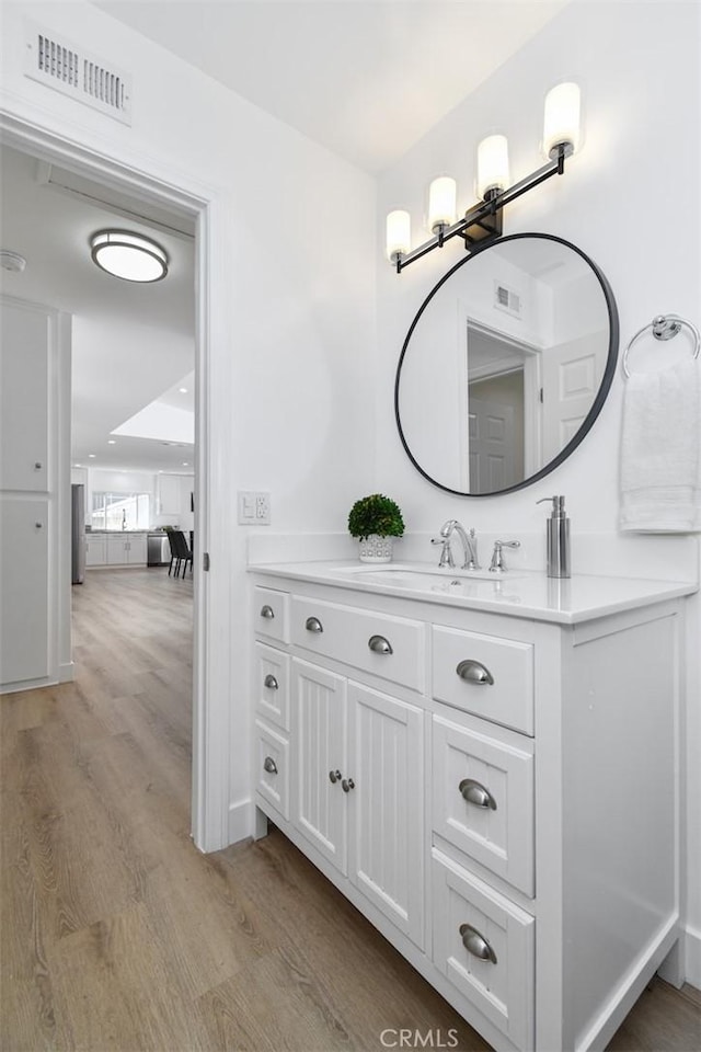 6215 Keystone St, Simi Valley, CA 93063 - bathroom with wood finished floors and vanity
