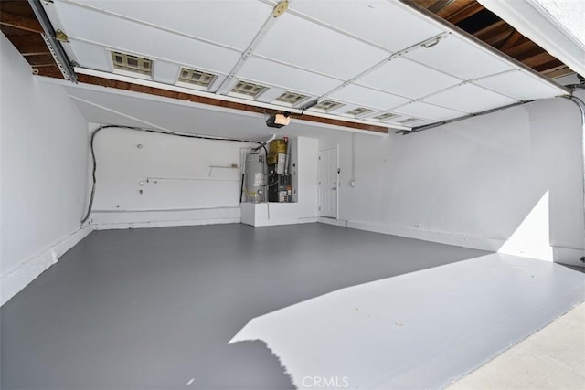 6215 Keystone St, Simi Valley, CA 93063 - garage with gas water heater, a garage door opener, heating unit, and baseboards