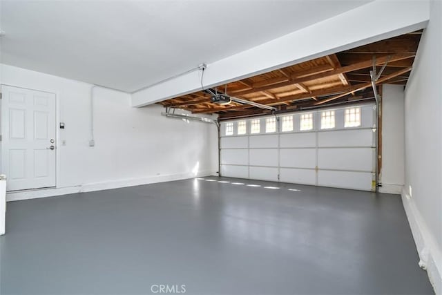 6215 Keystone St, Simi Valley, CA 93063 - garage featuring a garage door opener and baseboards