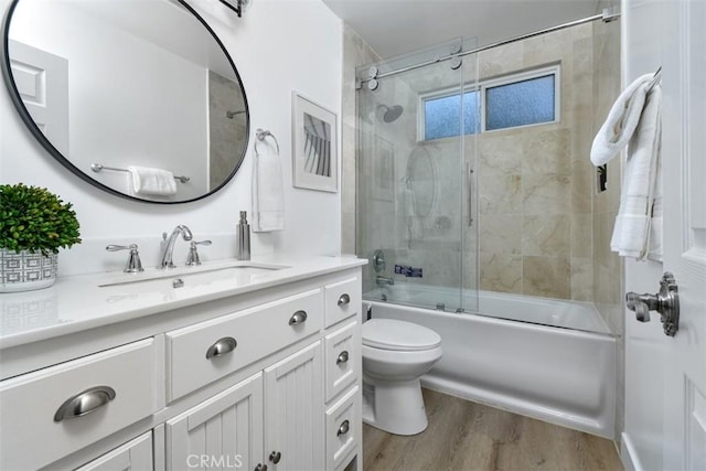 6215 Keystone St, Simi Valley, CA 93063 - full bathroom with wood finished floors, toilet, vanity, and shower / bath combination with glass door