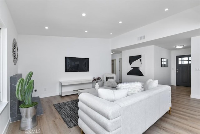 6215 Keystone St, Simi Valley, CA 93063 - living room with wood finished floors, recessed lighting, and baseboards