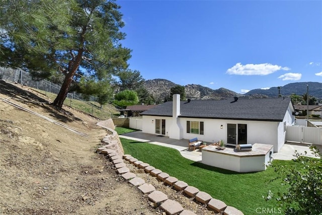 6215 Keystone St, Simi Valley, CA 93063 - back of property featuring a patio area, a mountain view, stucco siding, and roof with shingles