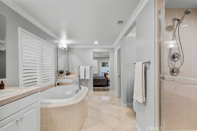 ensuite bathroom featuring a stall shower, a garden tub, visible vents, and crown molding