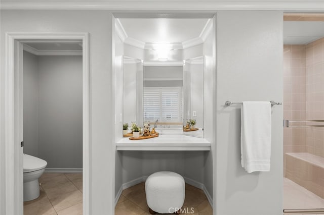 bathroom featuring baseboards, tiled shower, toilet, ornamental molding, and tile patterned floors