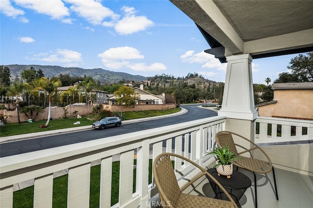 balcony featuring a mountain view