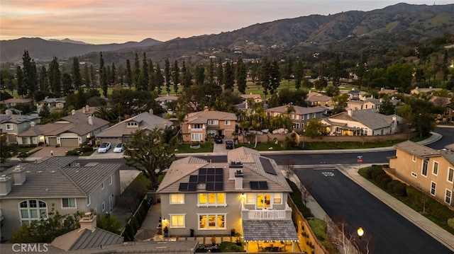 aerial view at dusk with a residential view and a mountain view