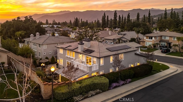 aerial view at dusk with a residential view and a mountain view