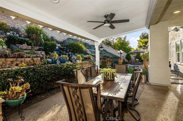 view of patio / terrace featuring a ceiling fan and outdoor dining space