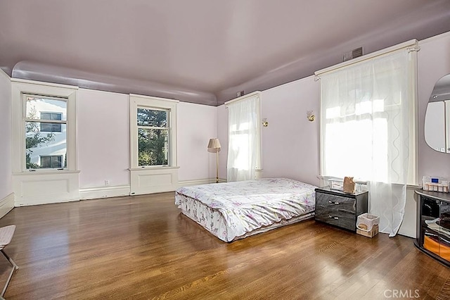 bedroom featuring wood finished floors