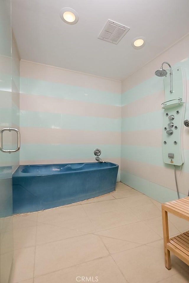 bathroom featuring tile patterned floors, recessed lighting, visible vents, and a shower with shower door