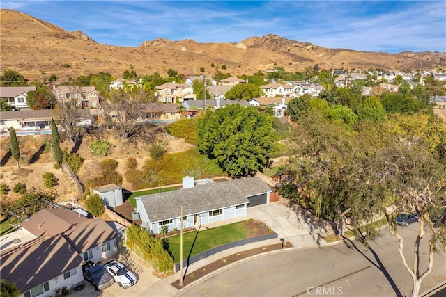 birds eye view of property with a mountain view and a residential view