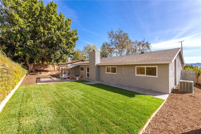 back of property featuring a patio area, stucco siding, a lawn, and a fenced backyard