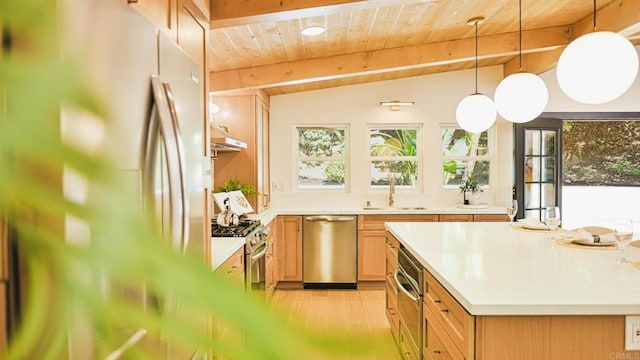 kitchen featuring lofted ceiling with beams, appliances with stainless steel finishes, wood ceiling, a sink, and under cabinet range hood