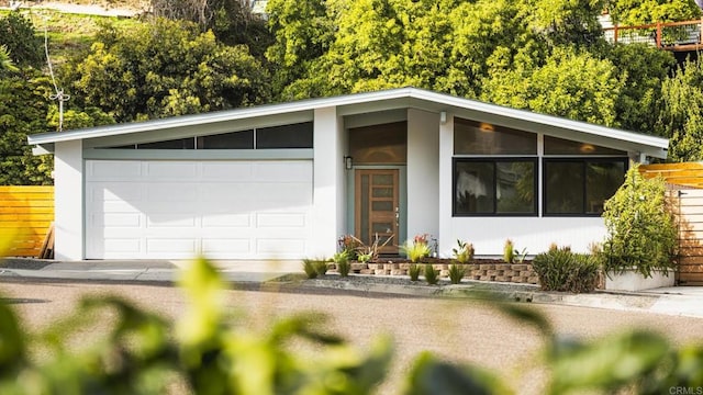 view of front of home featuring fence