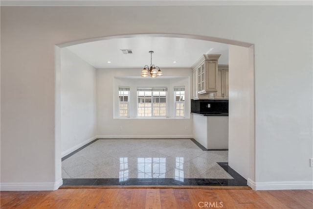 kitchen with granite finish floor, visible vents, baseboards, and recessed lighting