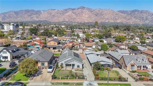 drone / aerial view with a residential view and a mountain view