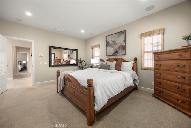 bedroom with recessed lighting, baseboards, and light carpet