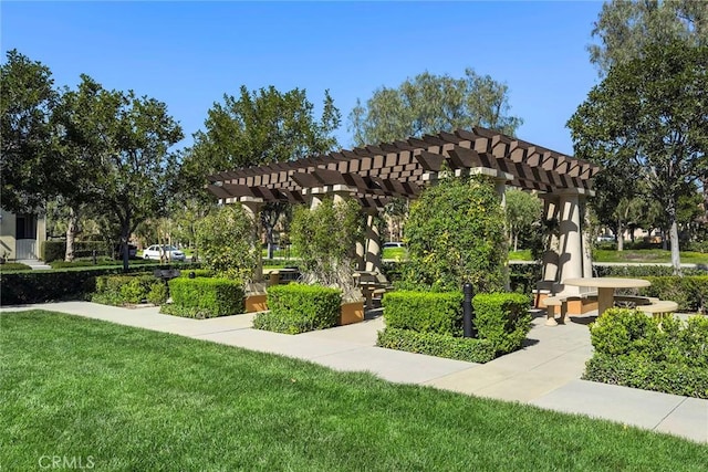 view of home's community with a lawn and a pergola