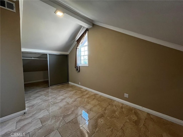 bonus room featuring visible vents, vaulted ceiling with beams, and baseboards