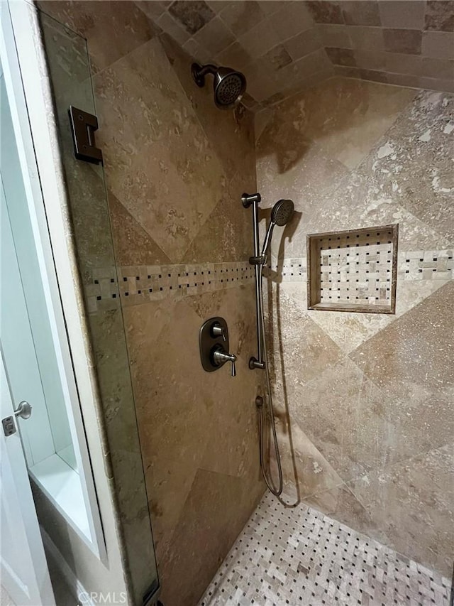 full bathroom with tiled shower