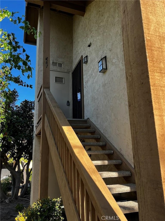 view of exterior entry featuring stucco siding