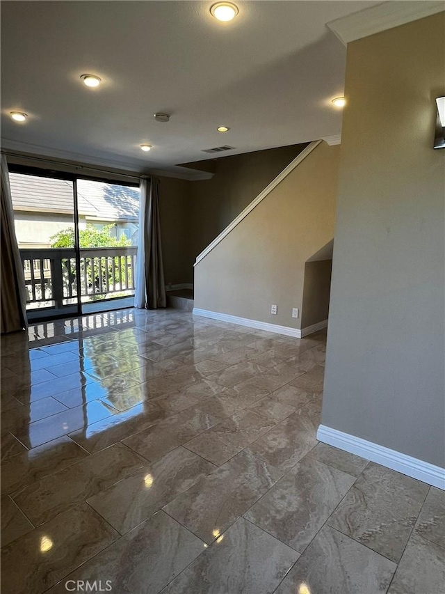 spare room with stairs, marble finish floor, visible vents, and baseboards