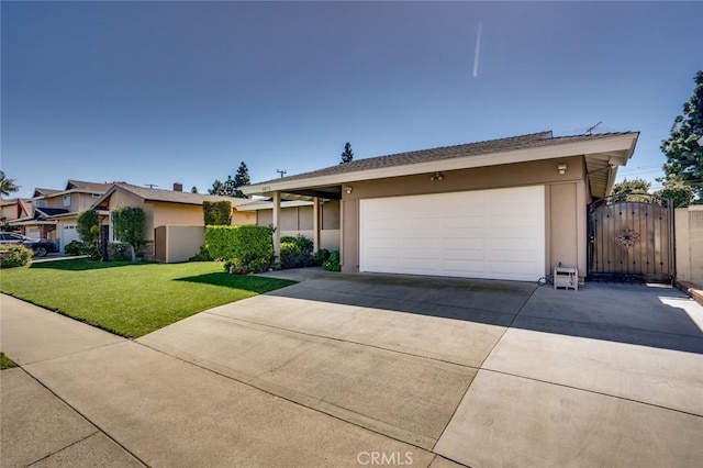 ranch-style home featuring an attached garage, driveway, a gate, stucco siding, and a front yard