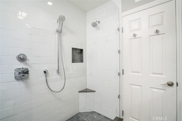 full bath featuring a shower stall