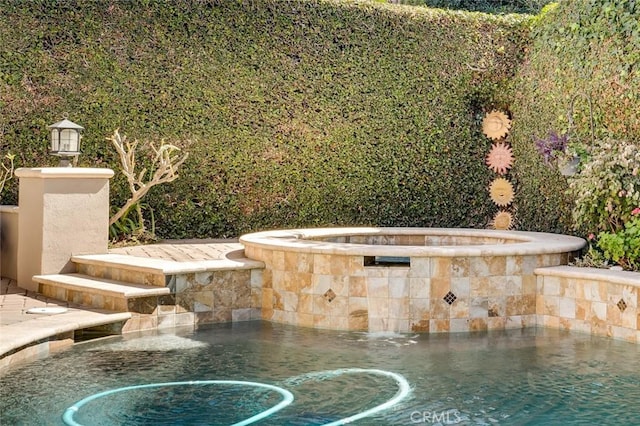 exterior details with a hot tub